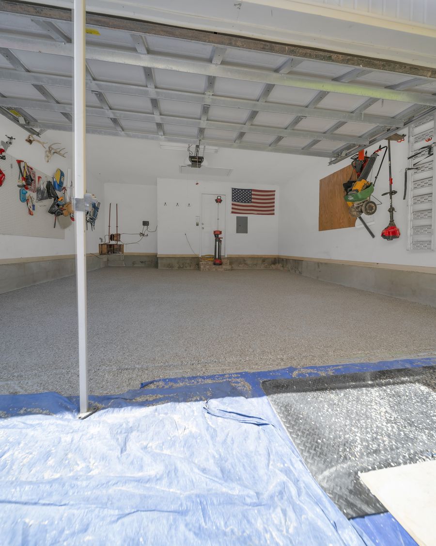 The same garage seen from the driveway with the finished chip flake floor down
