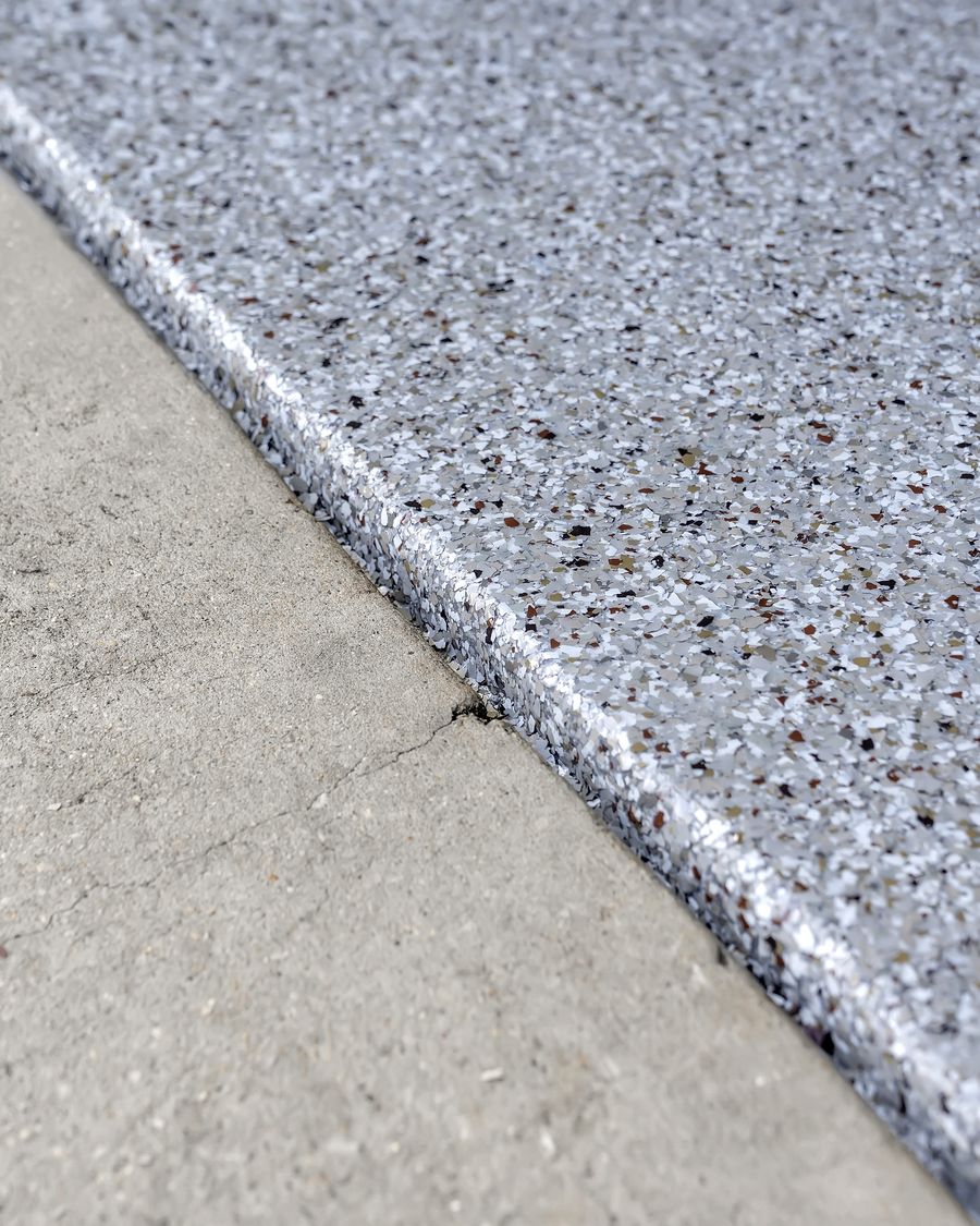 Close up of the coating edge, showing how much build sits on top of the bare concrete