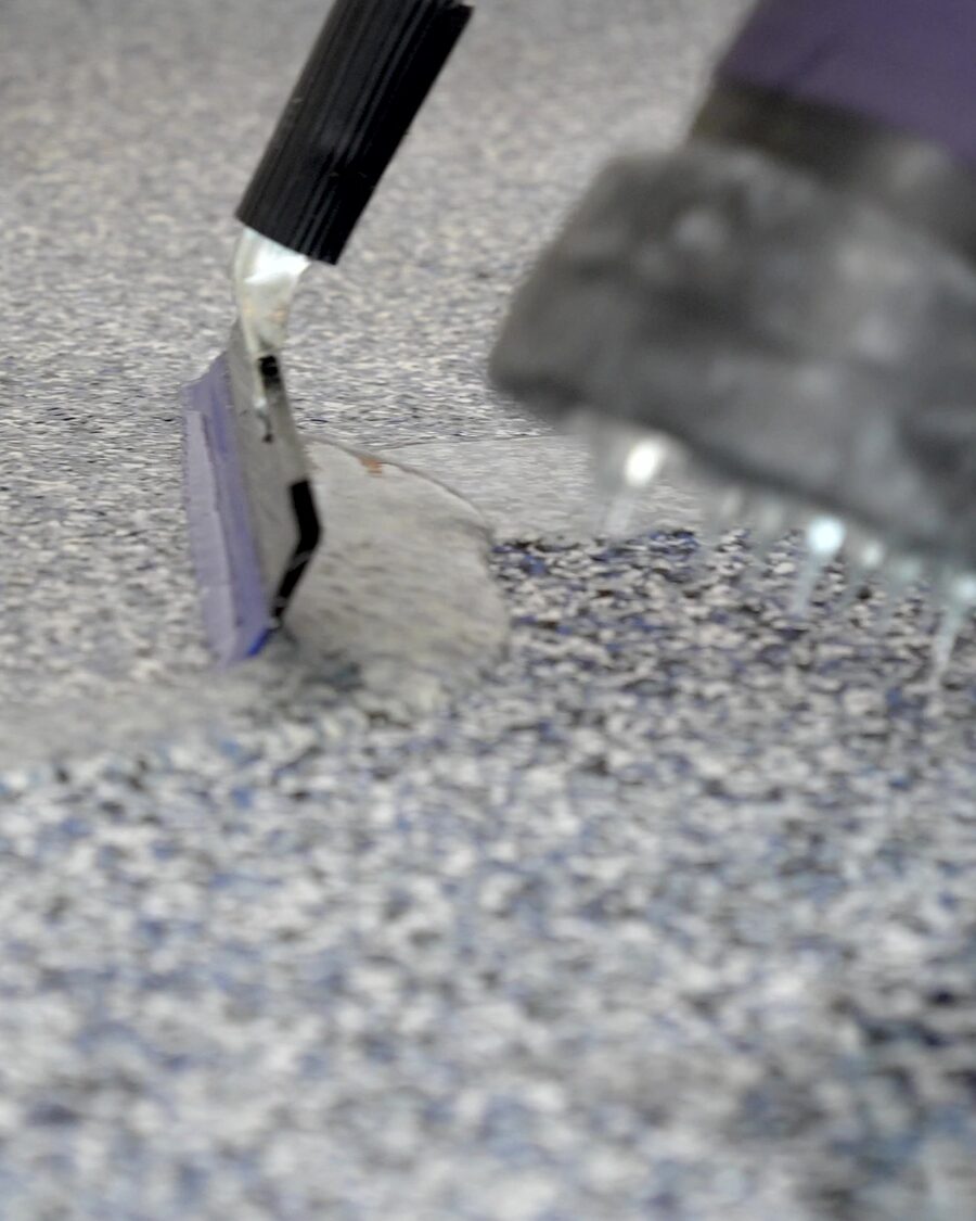 Pulling topcoat across a finished vinyl flake garage floor